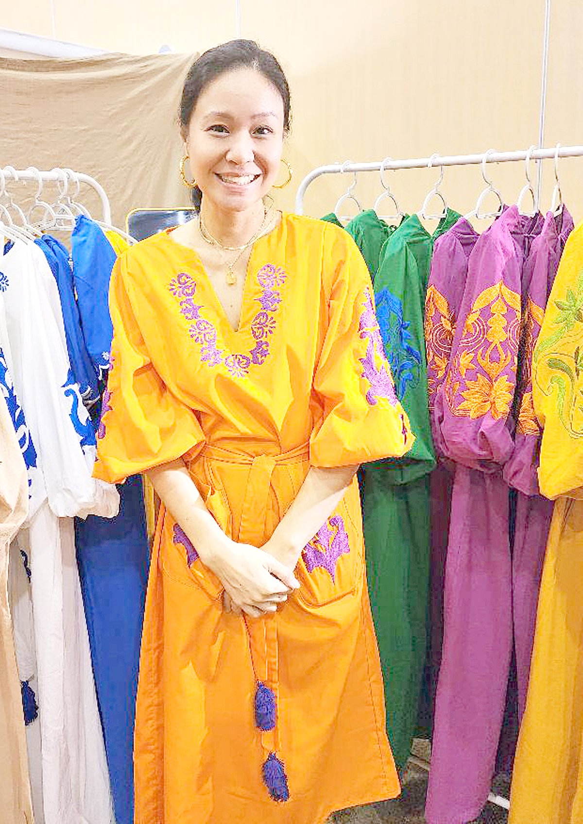 Mariel San Agustin with her embroidered clothes.